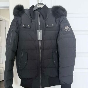Moose Knuckles Black Puffer Jacket with Fur Accents
